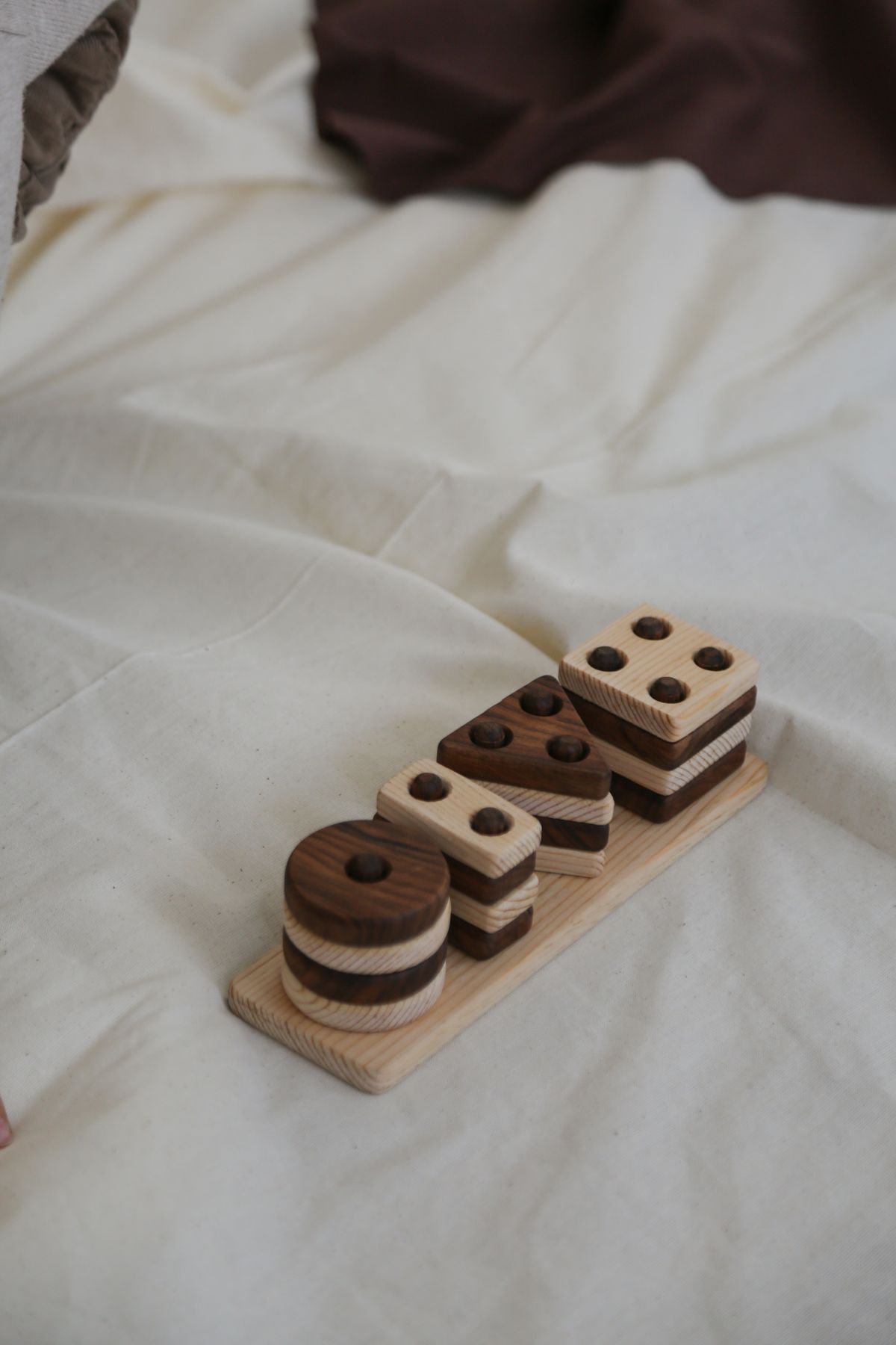 Simple wooden geometric blocks on a neutral surface
